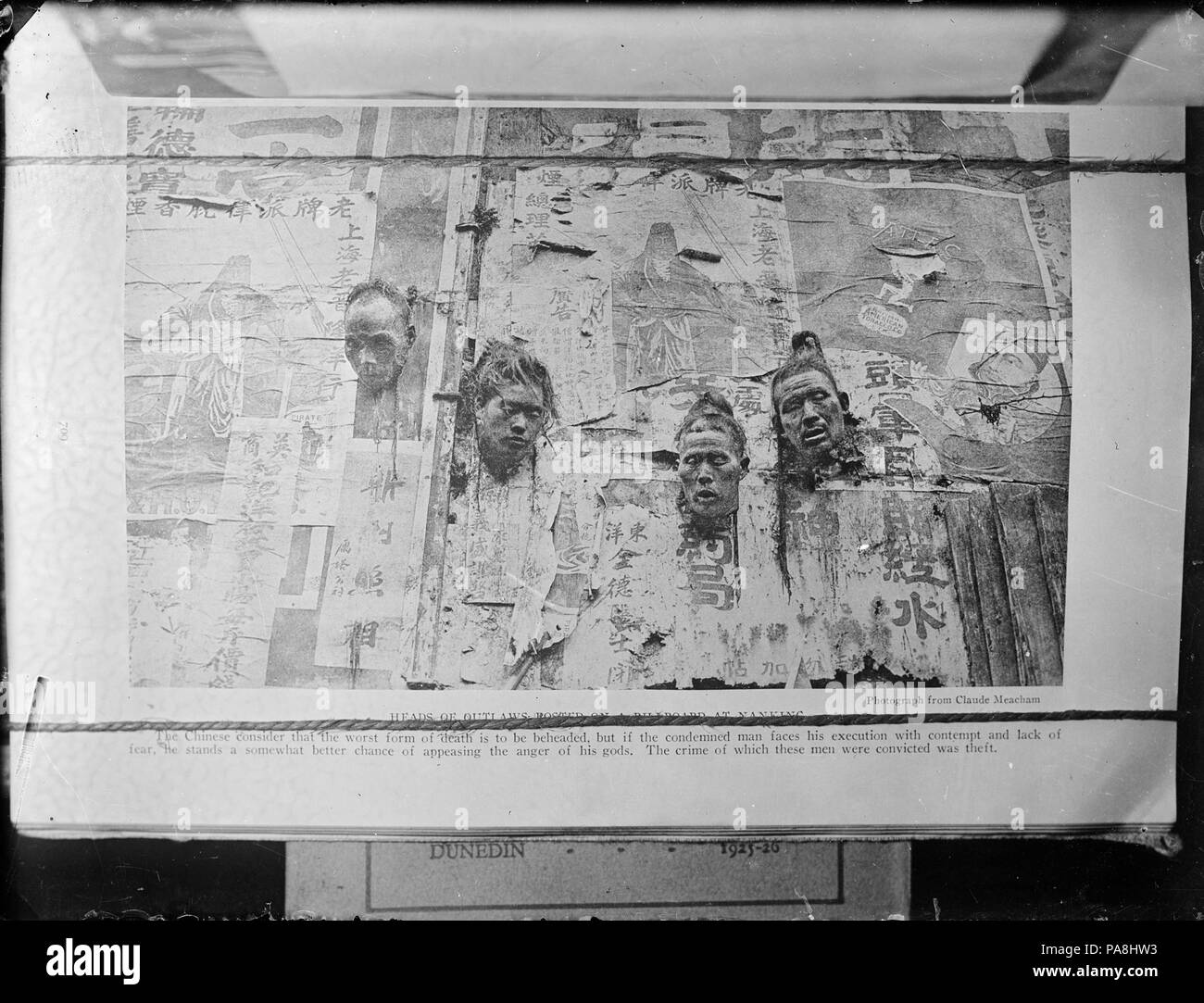 112 Heads of robbers posted on a billboard at Nanking, China ATLIB 305965 Stock Photo