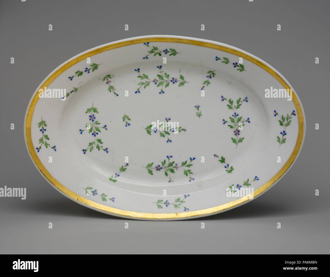 Platter. Culture: French. Dimensions: 1 15/16 x 14 1/4 x 9 15/16 in. (4.9 x 36.2 x 25.2 cm). Date: 1815-30. Museum: Metropolitan Museum of Art, New York, USA. Stock Photo