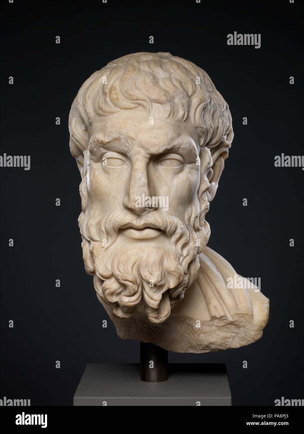 Marble head of Epikouros. Culture: Roman. Dimensions: 19 5/8 × 9 3/4 × 11 1/2 in. (49.8 × 24.8 × 29.2 cm). Date: 2nd century A.D..  Copy of a Greek statue of the 1st half of the 3rd century B.C.  The philosopher, who lived from 341 to 271 B.C., must have been honored by a portrait statue made late in his lifetime or soon after his death. Numerous Roman copies reproduce the same original, showing the esteem in which Epicurus' teachings were held. Museum: Metropolitan Museum of Art, New York, USA. Stock Photo