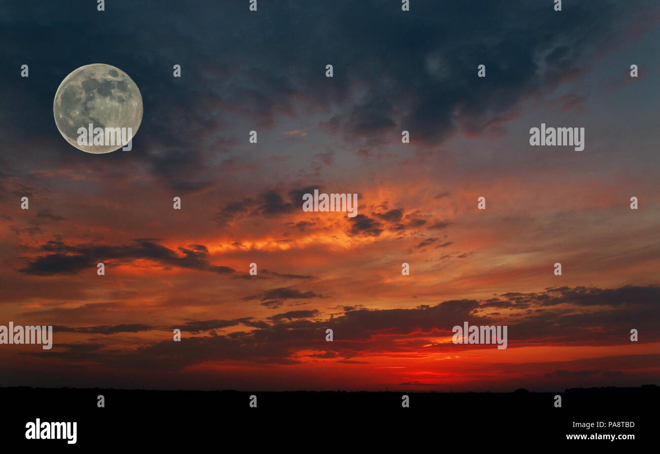 Red Sky During Sunset With A Big Moon In The Full Moon Phase And The Silhouette Of A Small Plane Image Of Nature Stock Photo Alamy