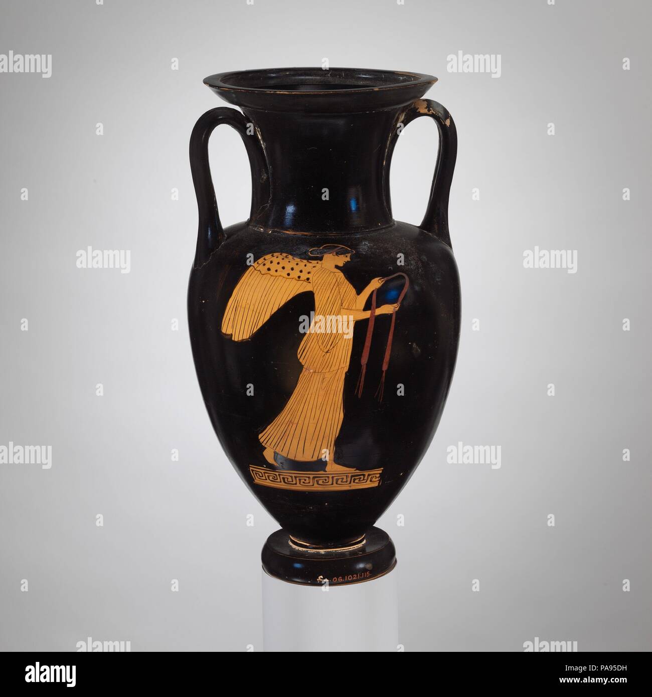 Terracotta Nolan neck-amphora (jar). Culture: Greek, Attic. Dimensions: H.  13 in. (33 cm). Date: ca. 460 B.C.. Obverse, Nike (the personification of  victory) holding a fillet Reverse, youth leaning on staff The