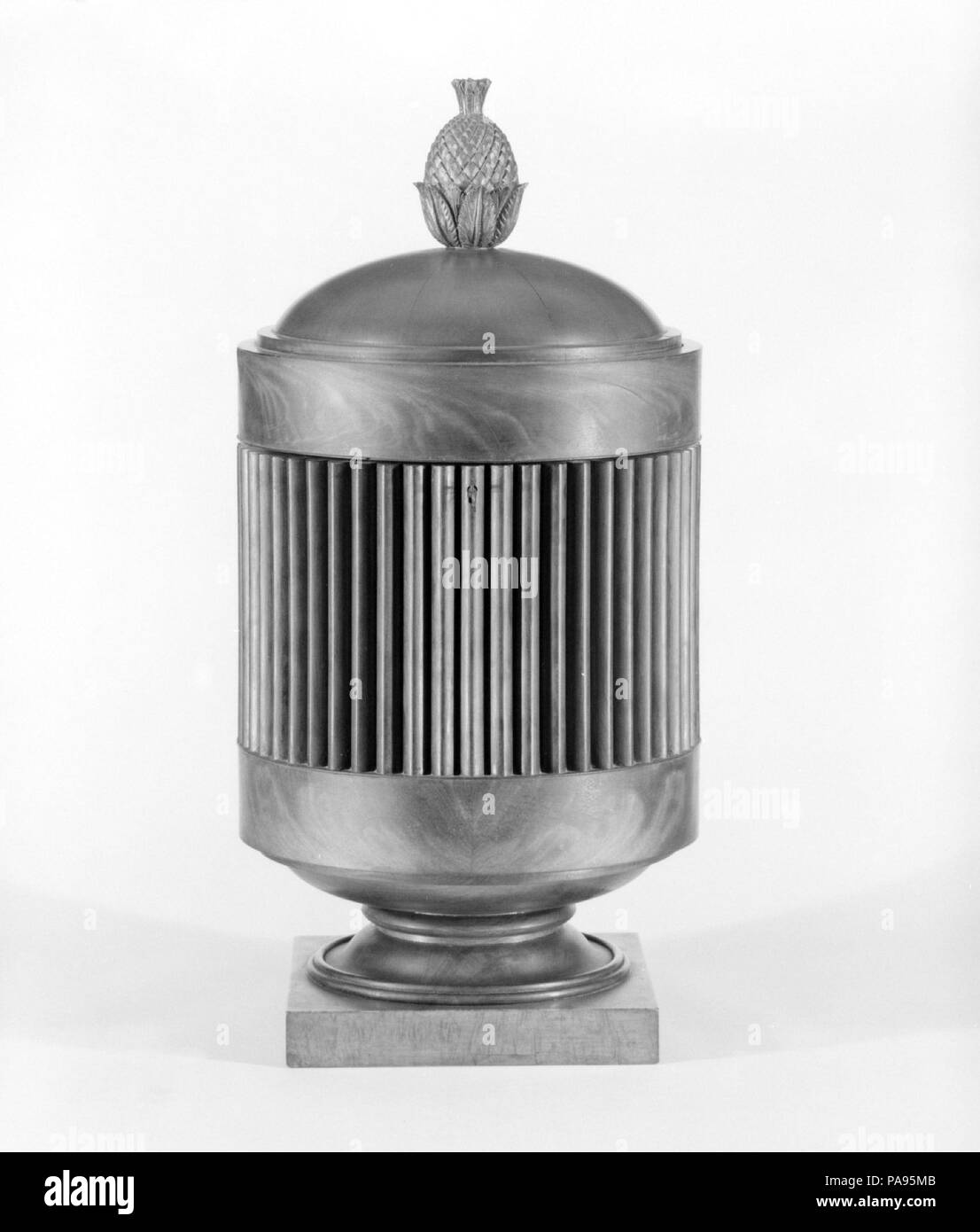 Knife Urn. Culture: American. Dimensions: 25 11/16 x 12 9/16 in. (65.2 x 31.9 cm). Date: ca. 1820.  Knife boxes typically were displayed on the top of sideboards and contained all the silver cutlery required for dining. The cylindrical form and multiple reeds with pointed Gothic profiles around the bodies of these examples are design features specific to Baltimore. Museum: Metropolitan Museum of Art, New York, USA. Stock Photo