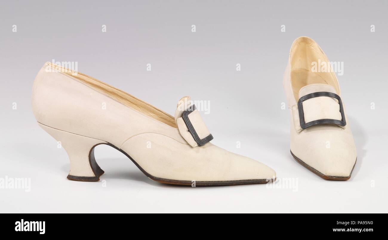Pumps. Culture: French. Designer: Pierre Yantorny (Italian, 1874-1936). Date: 1914-19.  Pietro Yantorny (1874-1936), the self-proclaimed 'most expensive shoemaker in the world', was a consummate craftsman utterly devoted to the art of shoemaking.  Yantorny sought to create the most perfectly crafted shoes possible for a select and exclusive clientele of the most perfectly dressed people.  Yantorny's shoes are particularly noted for the graceful curve of the instep, a feature the maker himself affirmed as being of utmost importance in a 1913 New York Times article.  This pair of Colonial pumps  Stock Photo