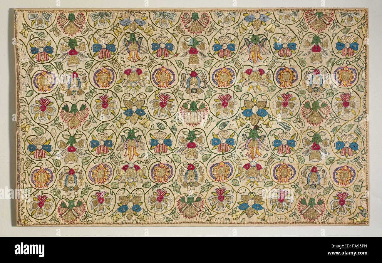 Long cushion cover. Culture: British. Dimensions: Overall: 20 7/8 × 34 1/2 in. (53 × 87.6 cm). Date: ca. 1600.  This is one of the most popular Elizabethan embroidery designs; it appears in numerous variations on caps, bodices, skirts and cushions. The motifs were derived from pattern books, herbals, and samplers. Museum: Metropolitan Museum of Art, New York, USA. Stock Photo