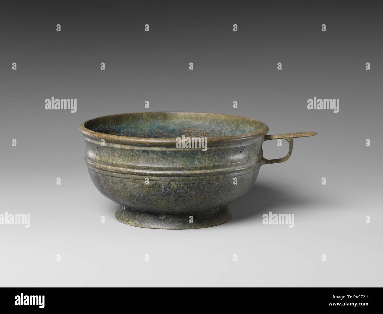 Bowl with Handle and Foot Ring. Culture: Korea. Dimensions: H. 3 in. (7.6 cm); Diam. 5 7/8 in. (14.9 cm). Museum: Metropolitan Museum of Art, New York, USA. Stock Photo
