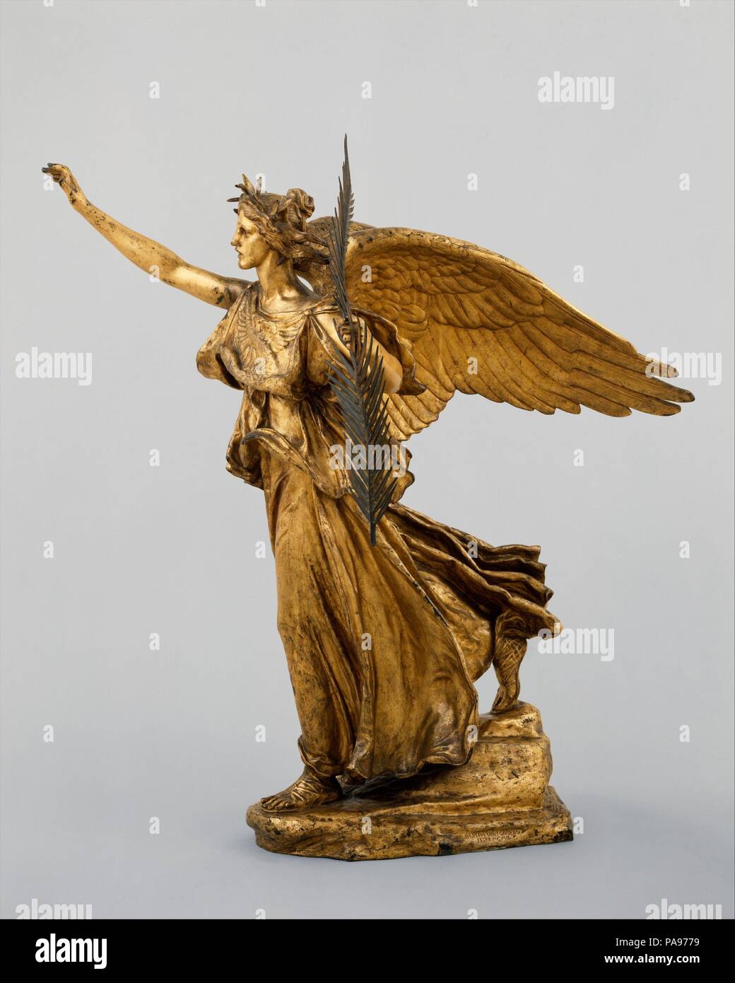 Victory. Artist: Augustus Saint-Gaudens (American, Dublin 1848-1907 Cornish, New Hampshire). Dimensions: 38 x 9 1/2 x 18 1/2 in., (96.5 x 24.1 x 47 cm). Date: 1892-1903; this cast, 1914 or after (by 1916).  Adapted from the full-size figure of Victory on Saint-Gaudens's equestrian monument to the Civil War general William Tecumseh Sherman (1892-1903; Grand Army Plaza, Manhattan), this winged allegorical figure is depicted as a triumphant guiding force. Her classicizing gown is emblazoned with an eagle, and she wears a crown of laurel and holds a palm frond--both traditional emblems of victory. Stock Photo