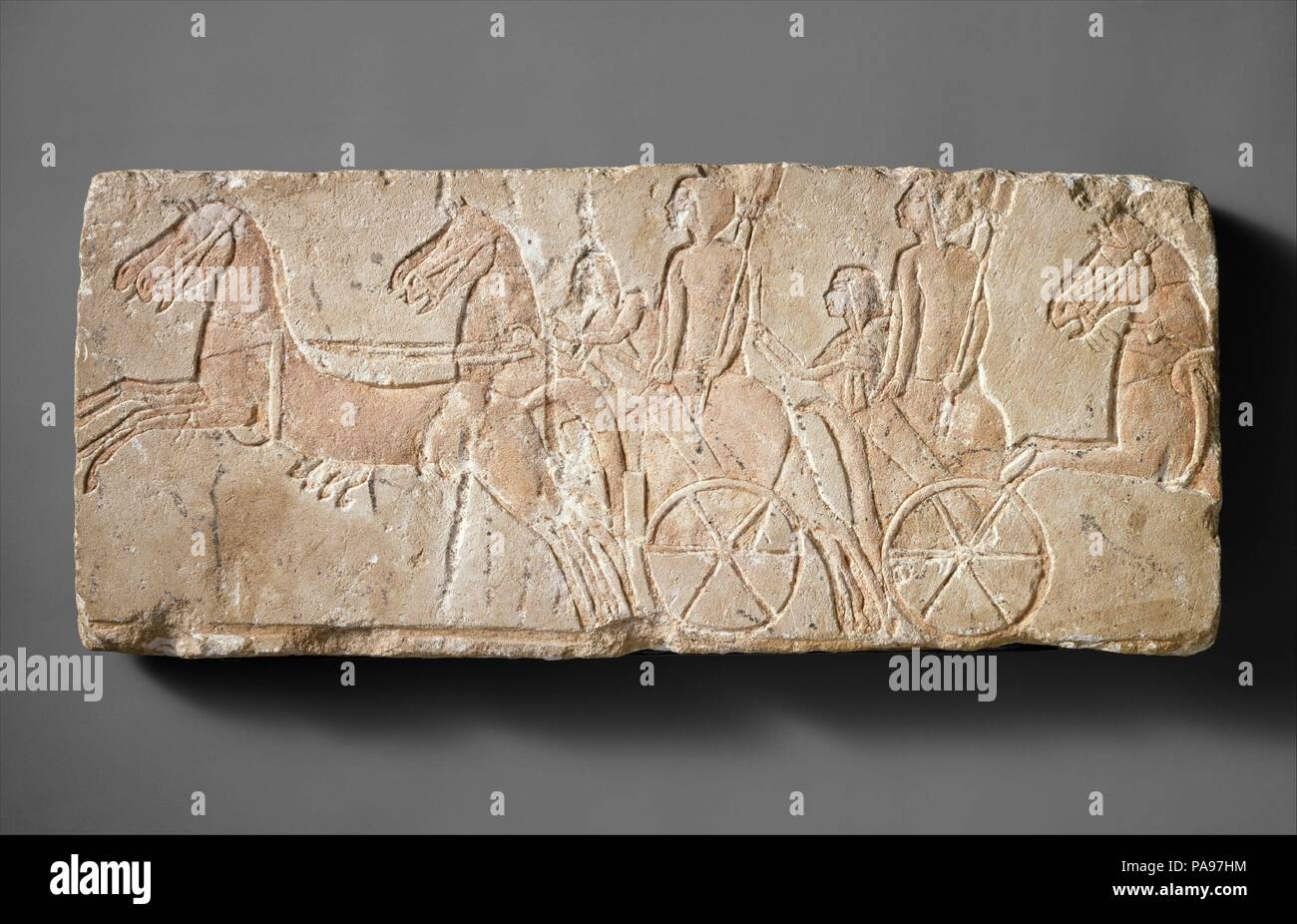 Chariots with Court Ladies. Dimensions: H. 23.5 cm (9 1/4); w. 54.7 cm (21 9/16 in). Dynasty: Dynasty 18. Reign: reign of Akhenaten. Date: ca. 1353-1336 B.C..  Court ladies taking part in a royal procession stand in light chariots, as their drivers urge on the horses. Museum: Metropolitan Museum of Art, New York, USA. Stock Photo