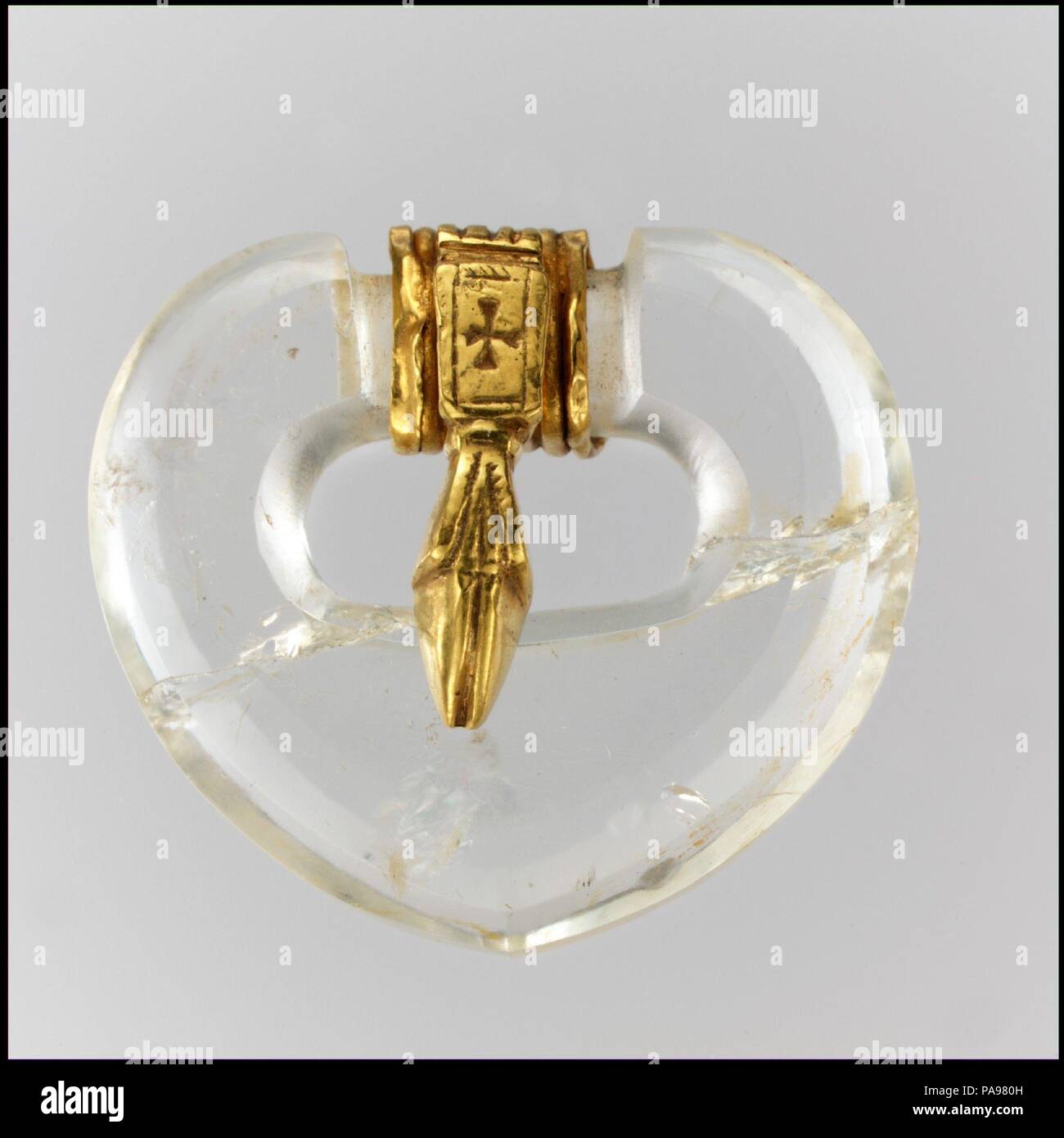 Rock Crystal Belt Buckle. Culture: East German (buckle), Byzantine (tongue). Dimensions: Overall: 1 3/4 x 1 9/16 x 11/16 in. (4.5 x 4 x 1.8 cm). Date: ca. 500 (buckle), 500-600 (tongue).  It is impossible to know precisely when the delicate gold tongue was added to the buckle, but the ensemble conveys the ease with which Byzantine and Germanic styles were combined. Museum: Metropolitan Museum of Art, New York, USA. Stock Photo