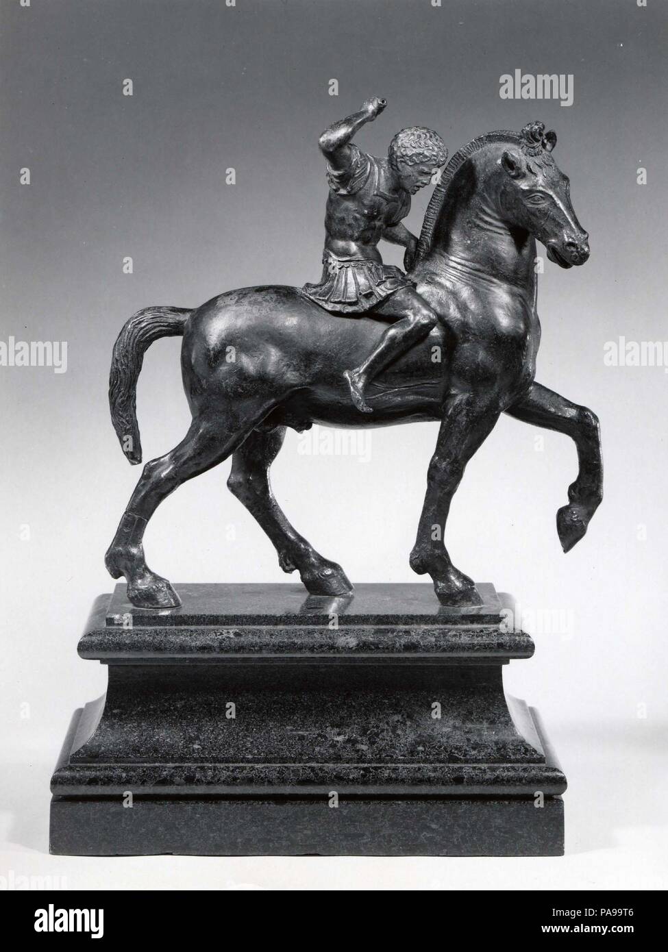 Warrior on Horseback. Artist: Attributed to Desiderio da Firenze (Italian, born Florence, active Padua, 1532-45). Dimensions: H. 25.8 cm (excluding the modern, green marble base).. Date: ca. 1540.  During the Renaissance, monumental bronze equestrian statues from Roman antiquity were highly admired for their technical virtuosity and as celebrations of triumphant ancient heroes. Several equestrian statues were created in emulation of Roman prototypes to honor contemporary rulers and military leaders. The small-scale warrior on horseback was a popular variation on the colossal equestrian statue. Stock Photo