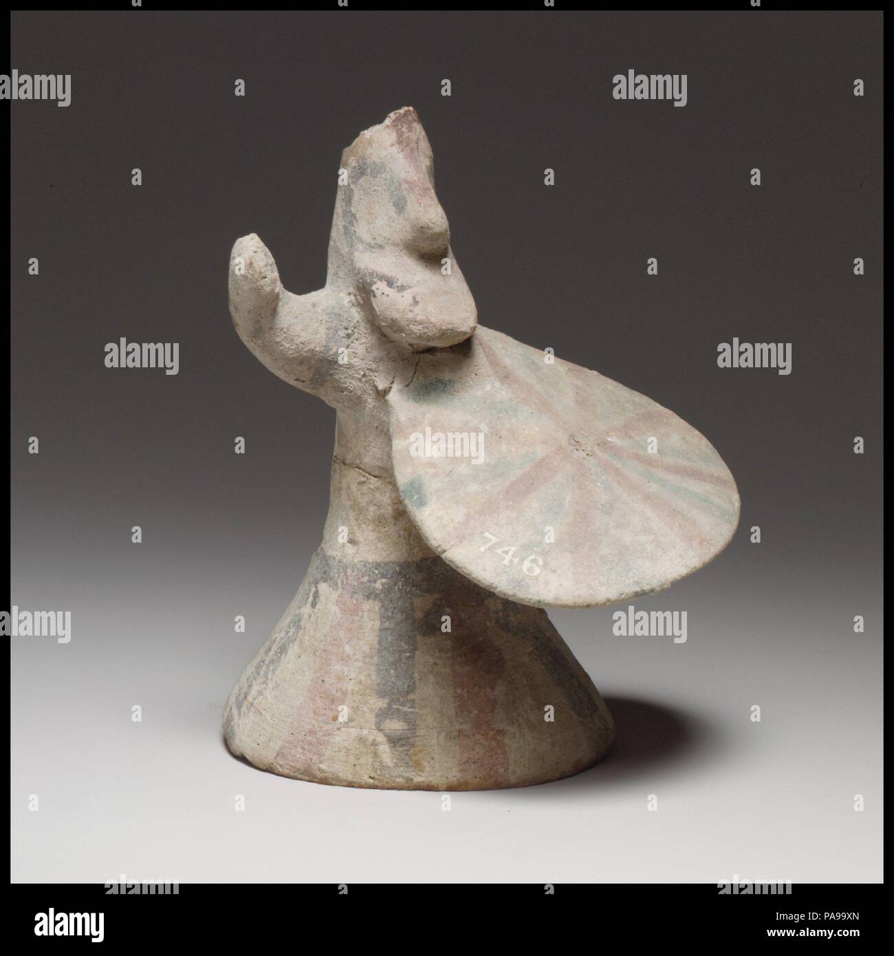 Shield bearer. Culture: Cypriot. Dimensions: H. 4 7/8 in. (12.4 cm). Date: ca. 750-600 B.C..  The lower part of the figurine is wheel-made, hollow, and bell-shaped; the upper body and the head are handmade. There is a perforation at either side of the waist for the attachment of movable legs. Museum: Metropolitan Museum of Art, New York, USA. Stock Photo
