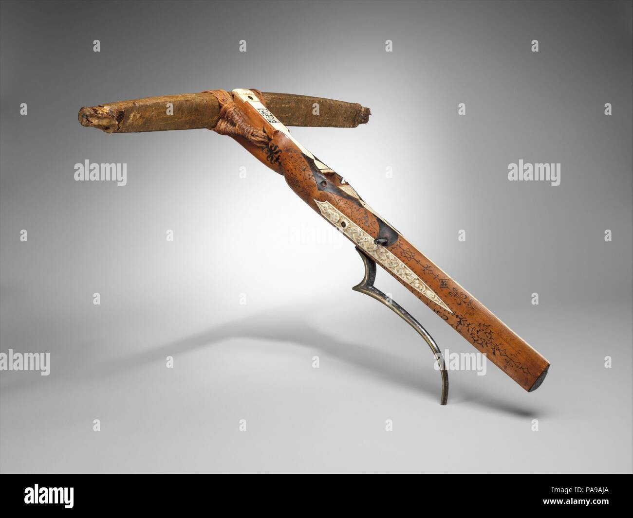 Crossbow of Count Ulrich V of Württemberg (1413-1480). Culture: German, probably Stuttgart. Dimensions: L. 28 1/16 in. (71.2 cm); W. 25 5/8 in. (65 cm); Wt. 6 lb. 9 oz. (2972 g). Maker: Attributed to Heinrich Heid von Winterthur (probably Swiss, active Stuttgart, recorded 1453-1460). Date: dated 1460.  Dated 1460 in the carved staghorn decoration, this is the earliest known dated crossbow in existence. The staghorn is inscribed with the coats of arms of Württemberg and Savoy, referring to the owner, Count Ulrich V of Württemberg (1413-1480), and his third wife, Princess Marguerite of Savoy (14 Stock Photo