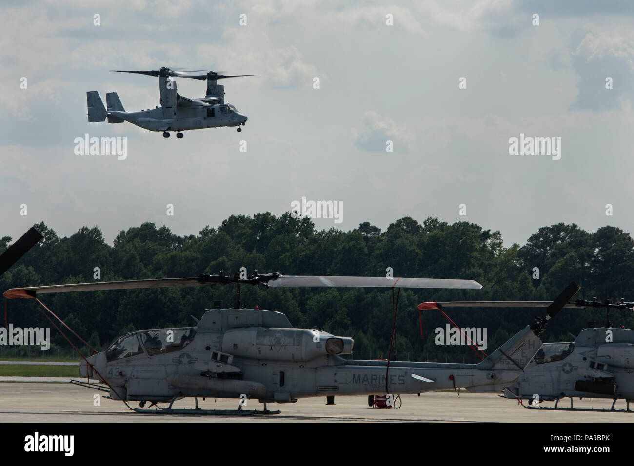 An MV-22 Osprey with Marine Medium Tiltrotor Squadron 264 (Reinforced), 22nd Marine Expeditionary Unit comes in for a landing at Marine Corps Air Station New River, N.C., July 13, 2018. Contractors worked with Marines to repair corrosion on the aircrafts K-fitting’s, allowing the aircrafts first flight in over two years to take off without a hitch. (U.S. Marine Corps photo by Cpl. Aaron Henson) Stock Photo