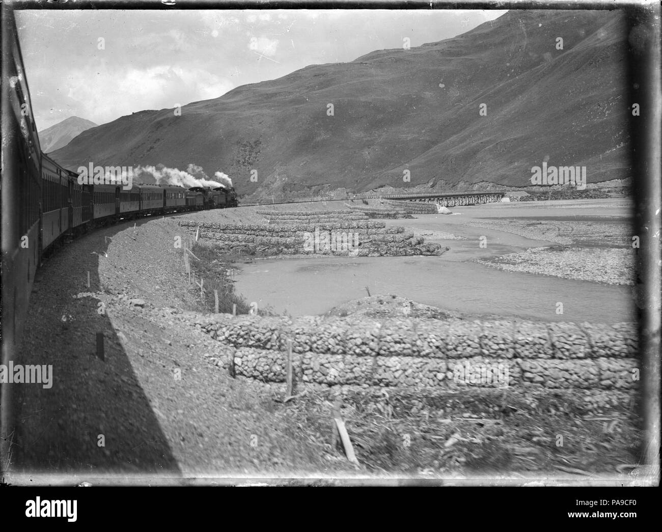 189 Otira to Christchurch Express train on a bend alongside the Waimakariri River. ATLIB 288018 Stock Photo