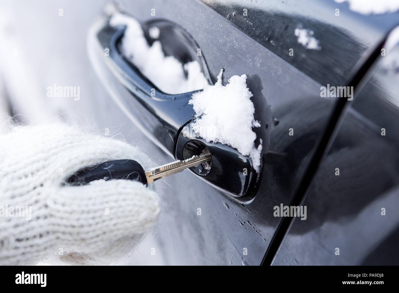 Young Beautiful Lady In Pretty White Knitted Mittens Try To Open