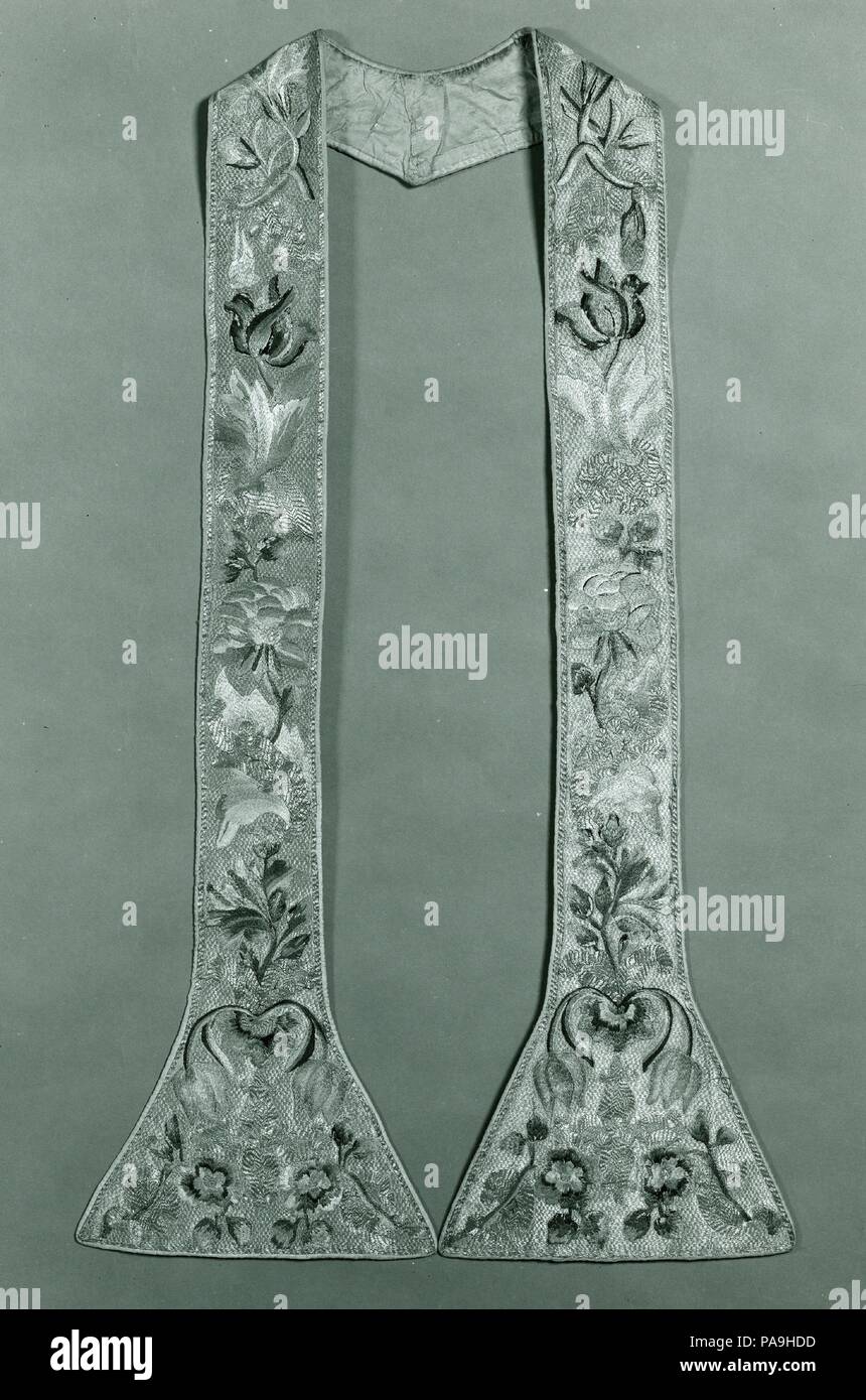Stole. Culture: Italian. Dimensions: From center back:  38 1/2 x 3 1/2-10 in. (97.8 x 8.9-25.4 cm). Date: 17th-18th century.  This stole forms a set with three other liturgical textiles in the Robert Lehman Collection: a chasuble  (1975.1.1797), a maniple1975.1.1798), and a burse (1975.1.1800). The four objects are embroidered in an allover polychrome floral design entirely surrounded by a solidly worked background in silvered metal thread with additional patterns in gilt metal thread. On the chasuble front and back large blossoms are arranged symmetrically on either side of a spray of pink ca Stock Photo