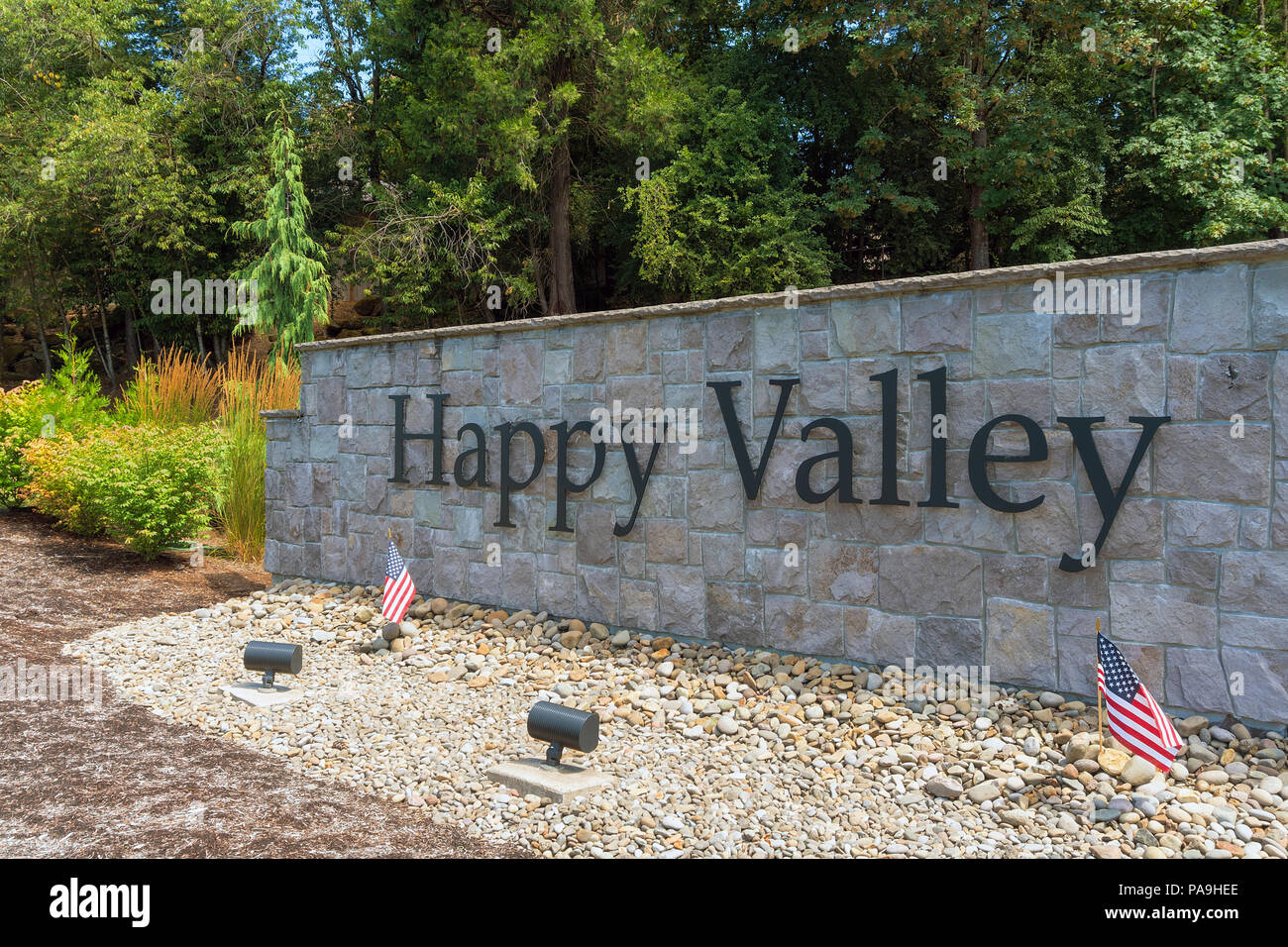 City of Happy Valley Oregon stone wall in the park with landscaping closeup Stock Photo