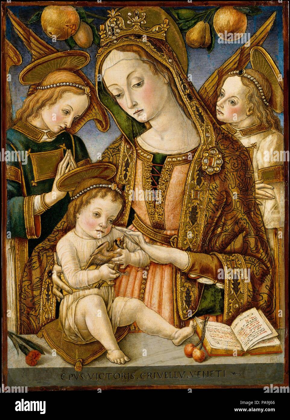 Madonna and Child with Two Angels. Artist: Vittore Crivelli (Italian, Venice, active by 1465-died 1501/2 Fermo). Dimensions: 21 7/8 x 16 in. (55.6 x 40.6 cm). Date: ca. 1481-82.  This charming Madonna and Child employs some of the same pictorial devices used by Vittore's brother Carlo, building up the gold to create three-dimensional embellishments. The parapet is inscribed with Vittore's name and on it are placed a carnation (emblem of love), cherries (like the apple, symbol of original sin), and a devotional book. The Child holds a goldfinch, symbolic of the Passion of Jesus. Museum: Metropo Stock Photo