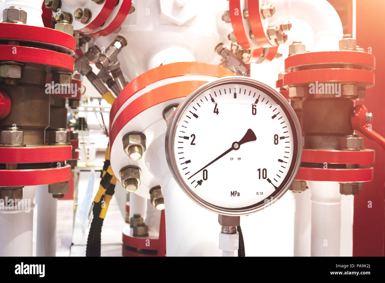 Close up of manometer, pipe, flow meter, water pumps and valves of heating system in a boiler