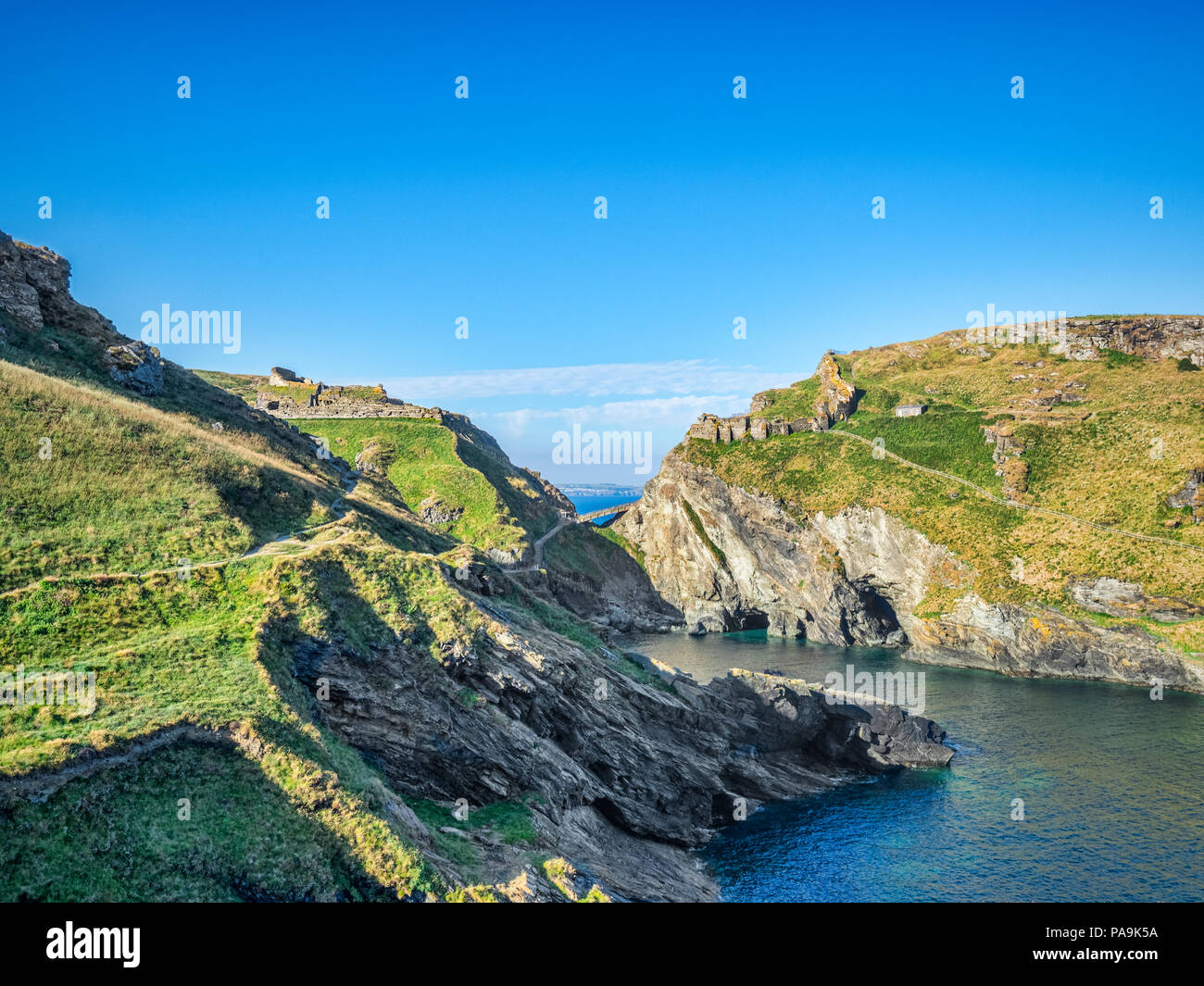 The ruins of Tintagel Castle, Cornwall, England, UK, on the mainland and The Island, seen from the South West Coast Path. Stock Photo