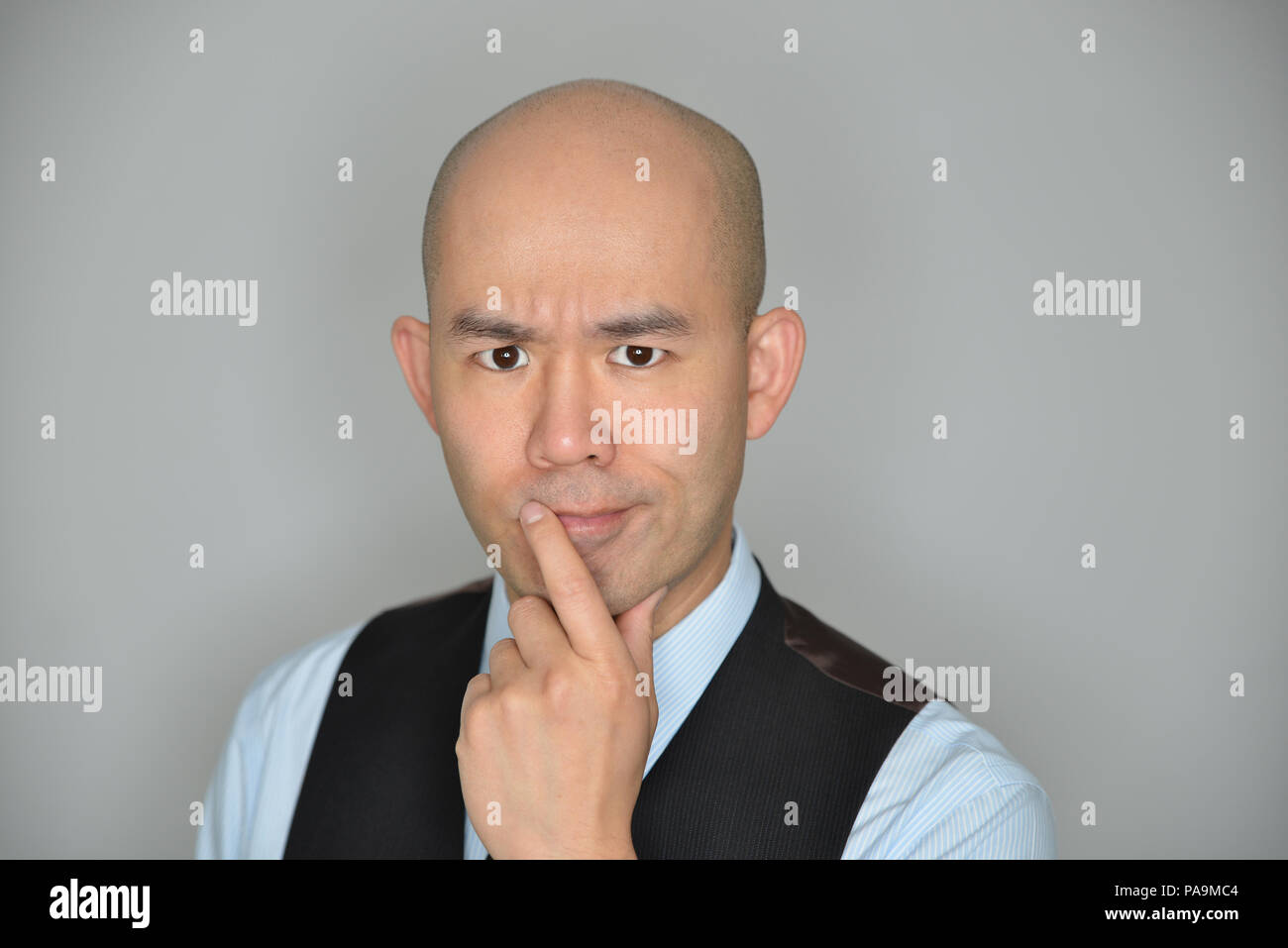 Businessman Confused and Perplexed Expression Isolated on Grey Stock Photo