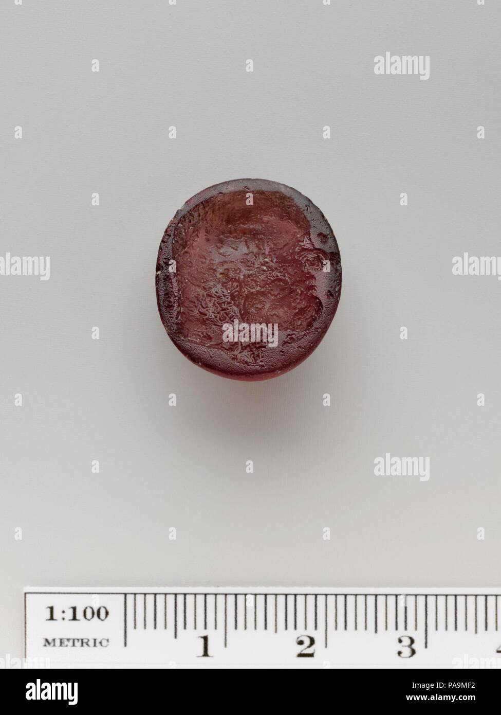 Glass ring stone. Culture: Greek. Dimensions: Diameter: 13/16 in. (2.1 cm). Date: 3rd-1st century B.C..  Head of bearded Herakles. Museum: Metropolitan Museum of Art, New York, USA. Stock Photo