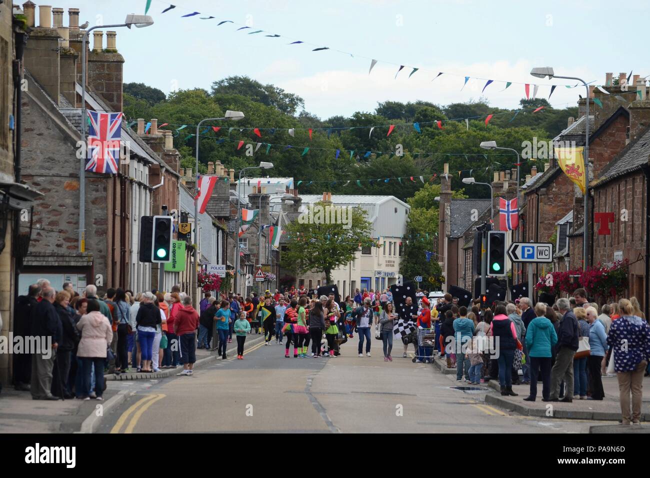 The Main Street in Golspie village in the Scottish Highlands, during the annual gala week 2015 Stock Photo