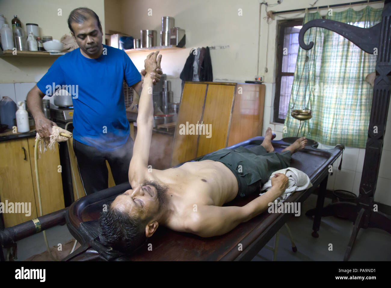 Ayurvedic treatment of ill people at Sambhavna Trust Clinic in Bhopal , India Stock Photo