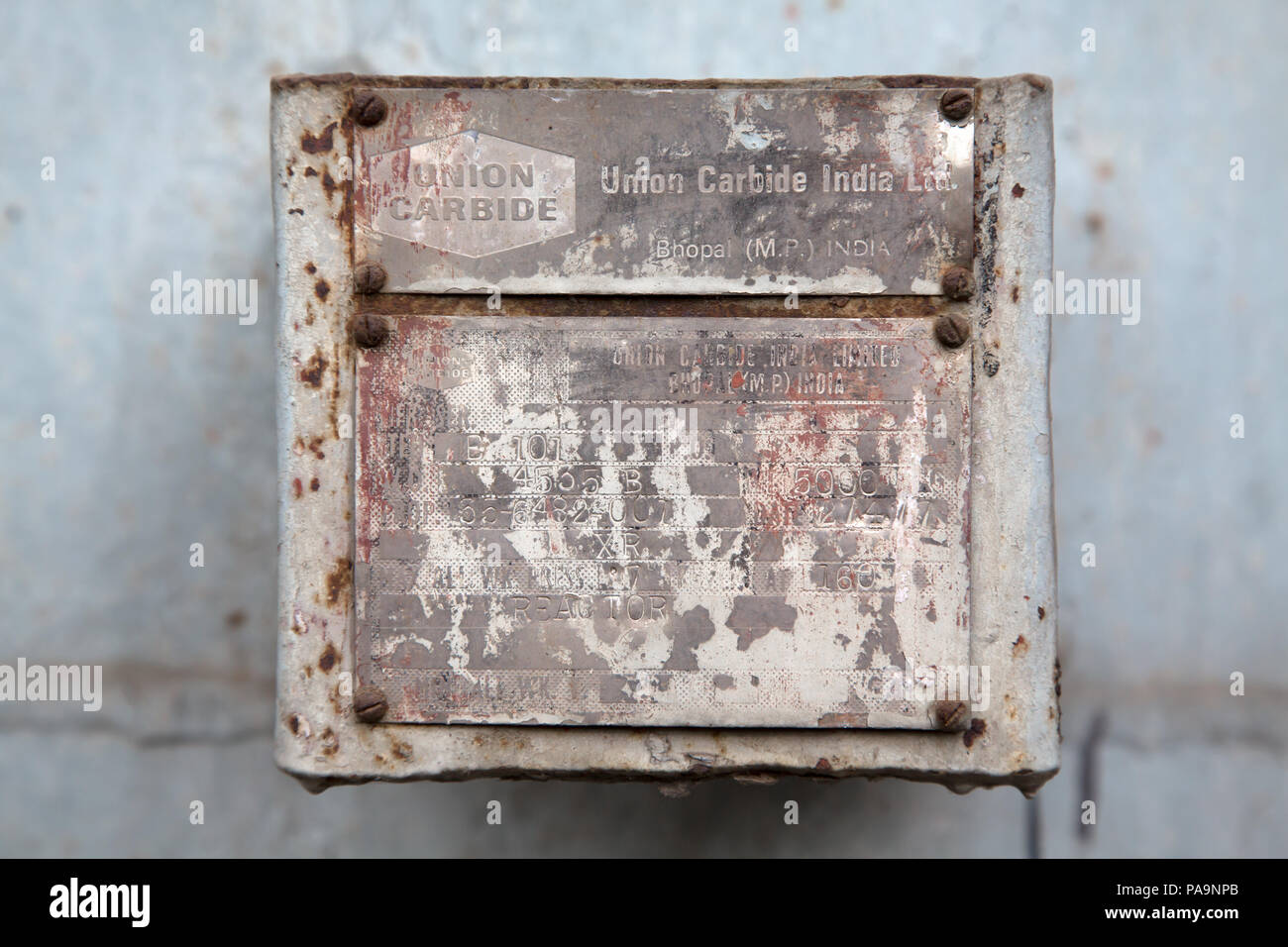 Authentic wall plate with writings inside the abandoned former Union Carbide industrial complex, Bhopal, India Stock Photo