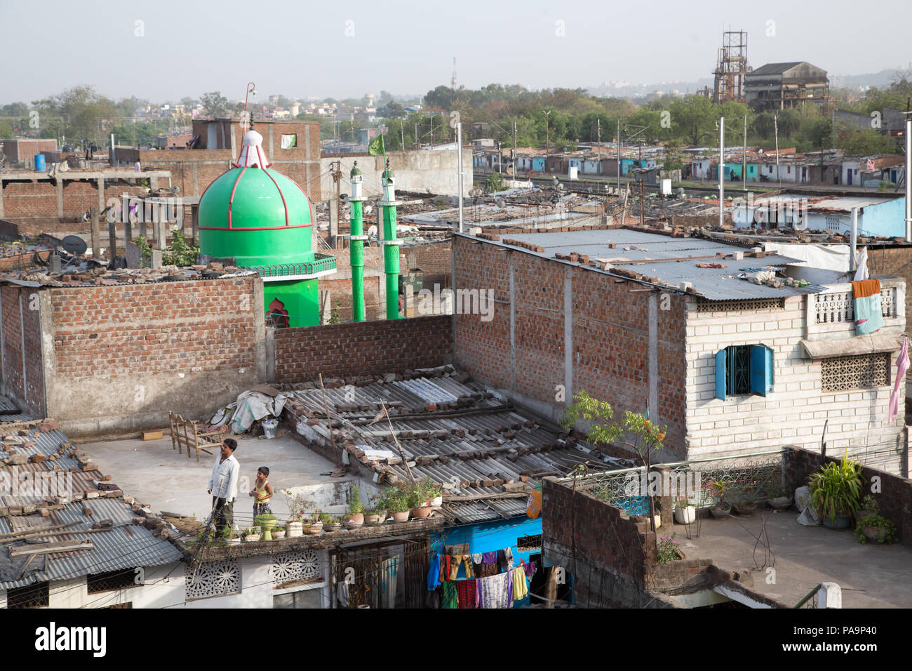 View on Arif Nagar area, with abandoned Union Carbide industrial complex at the back, Bhopal, India Stock Photo