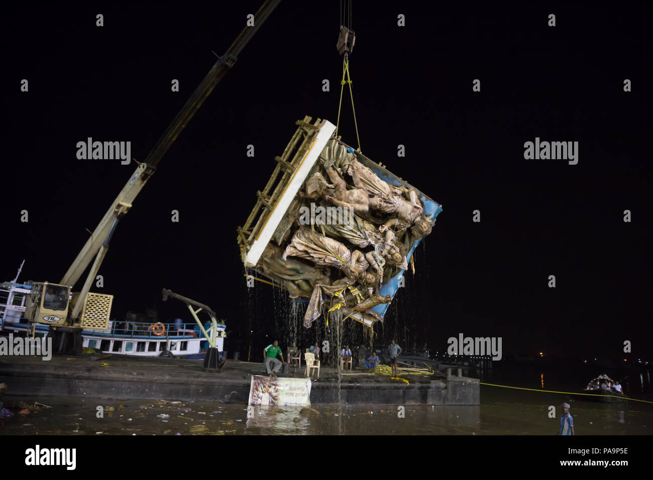 Immersion of Durga statue (pandal) in Hooghly river during Durga puja celebration in Kolkata, India Stock Photo