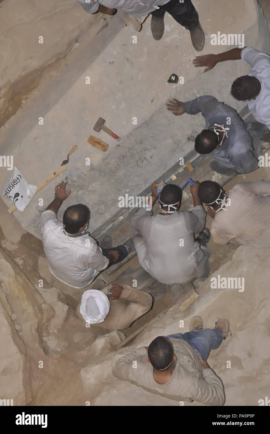 19 July 2018 - Alexandria, Egypt - The black granite sarcophagus uncovered in early July in Alexandria's Sidi Gaber district during foundation work on an apartment building, was opened today by a scientific archaeological committee and they discovered that three skeletons were discovered inside amidst sewage water that had seeped inside.  (MOA pool photo) Stock Photo