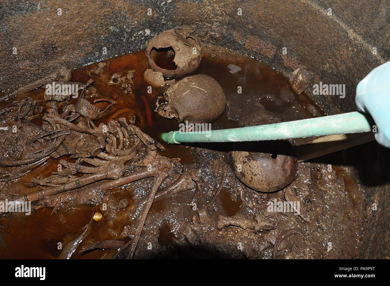 19 July 2018 - Alexandria, Egypt - The black granite sarcophagus uncovered in early July in Alexandria's Sidi Gaber district during foundation work on an apartment building, was opened today by a scientific archaeological committee and they discovered that three skeletons were discovered inside amidst sewage water that had seeped inside.  (MOA pool photo) Stock Photo