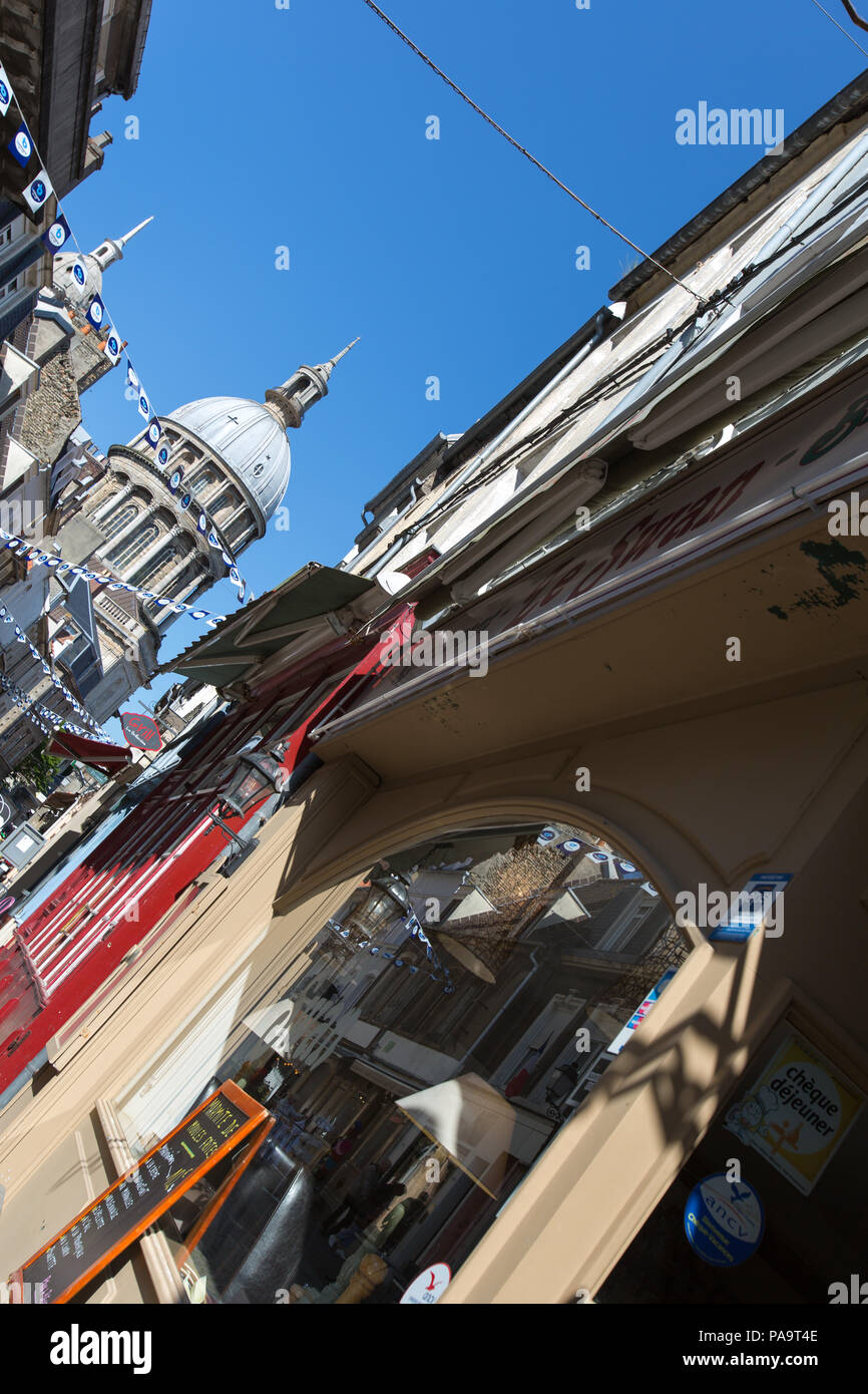 City of Boulogne-sur-Mer, France. Picturesque view of Boulogne-sur-Mer’s Rue de Lille with the dome of the Notre Dame Basilica in the background. Stock Photo