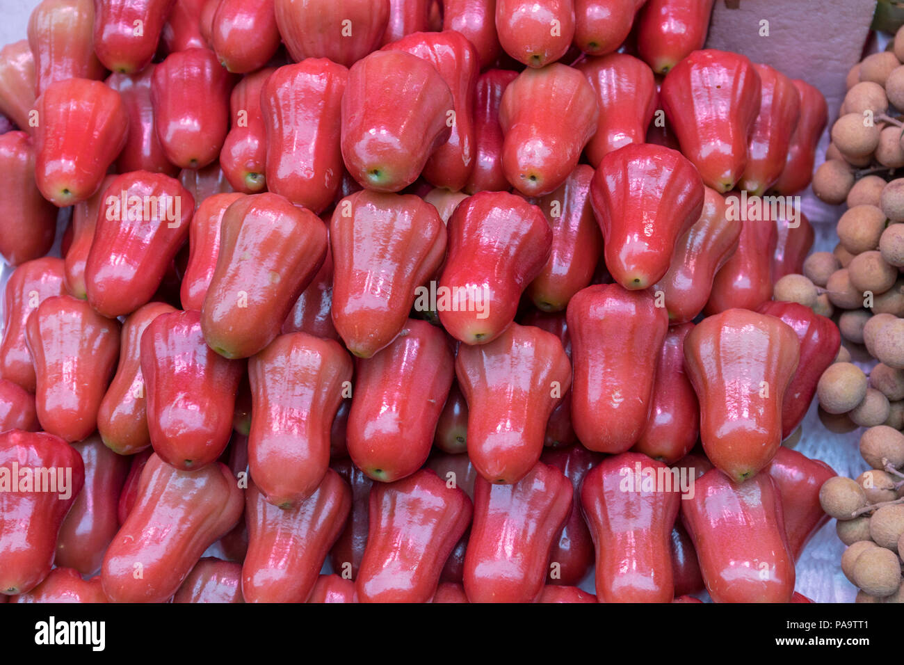 Big Pile of Frsh Rose Apples at Market Stock Photo