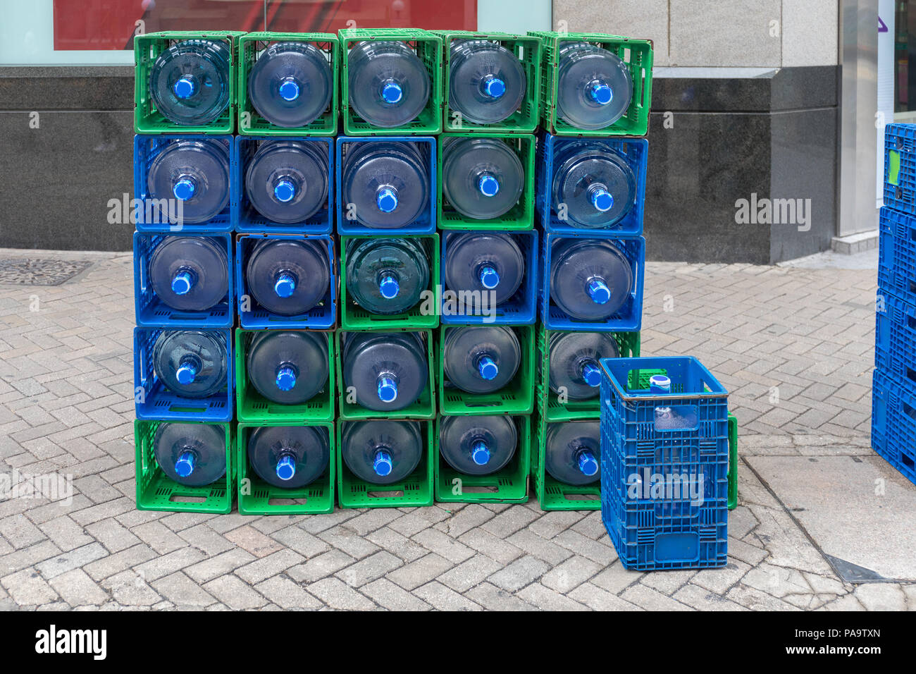 Stack of Filtered Bottled Water in Crates Delivery Stock Photo
