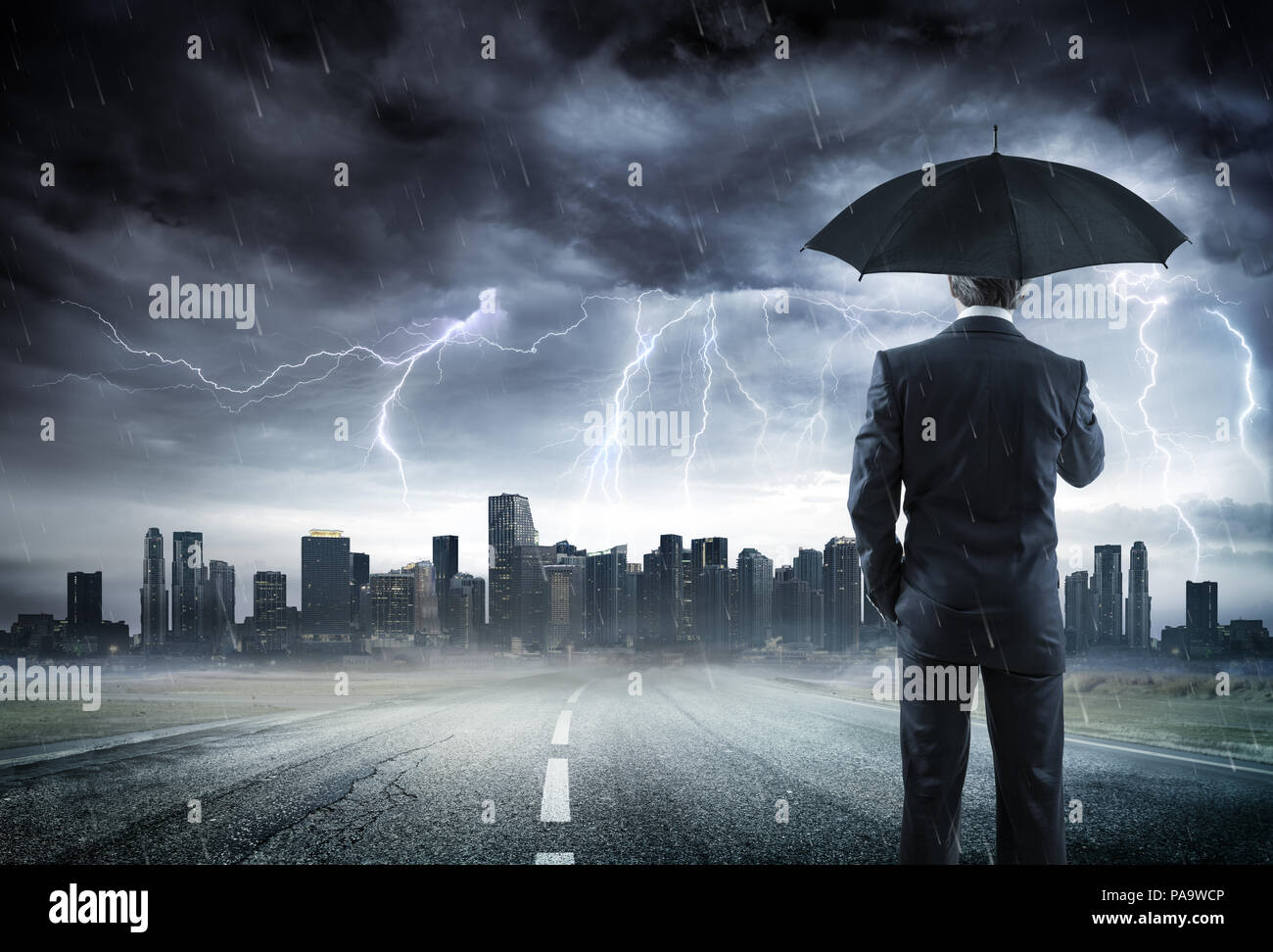 Businessman With Umbrella Looking Storm Over City Stock Photo Alamy