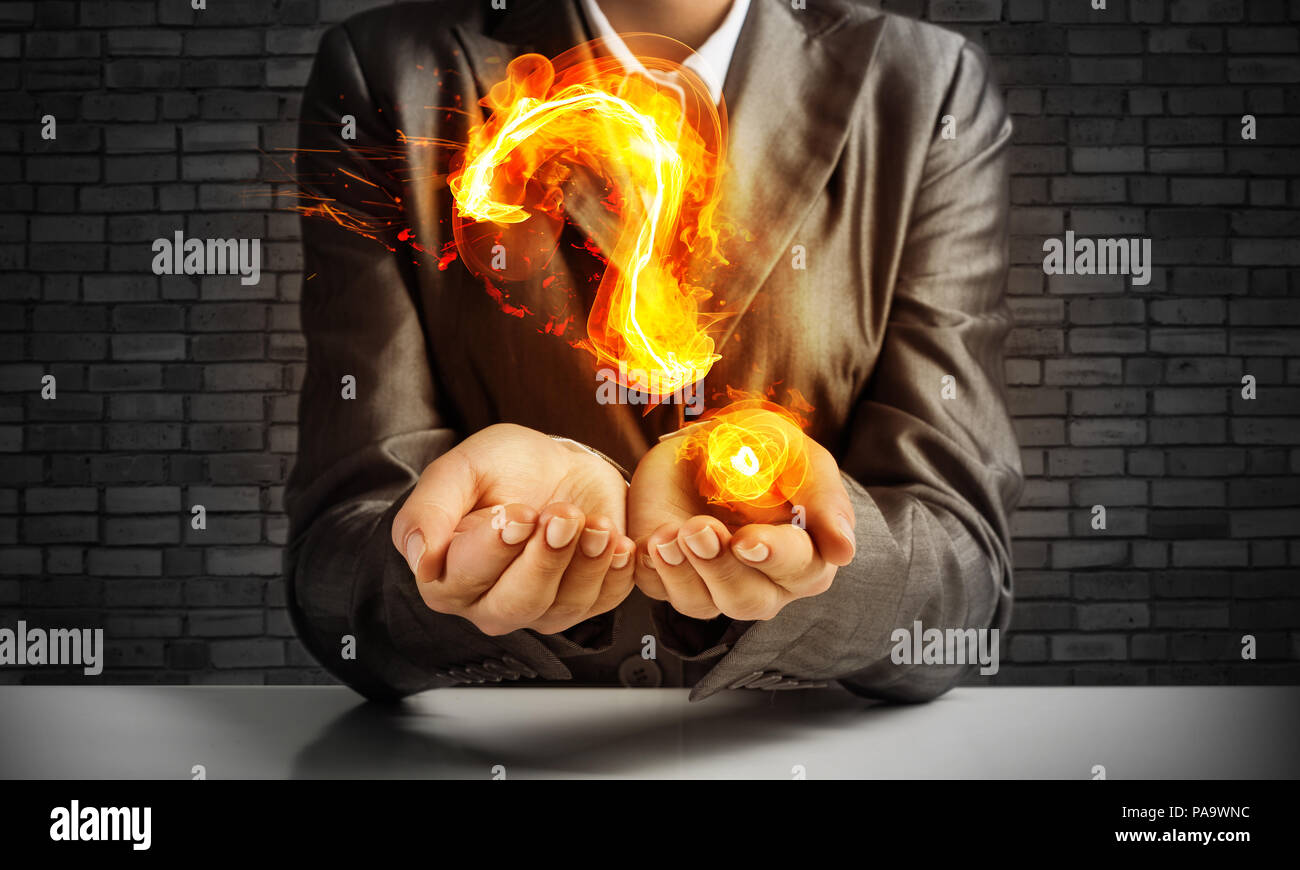 Businessman presenting question mark Stock Photo - Alamy