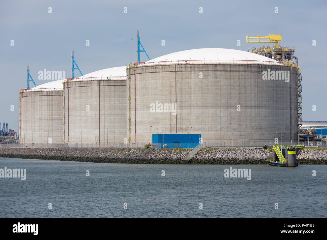 Dutch harbor Rotterdam with oil storage tanks Stock Photo