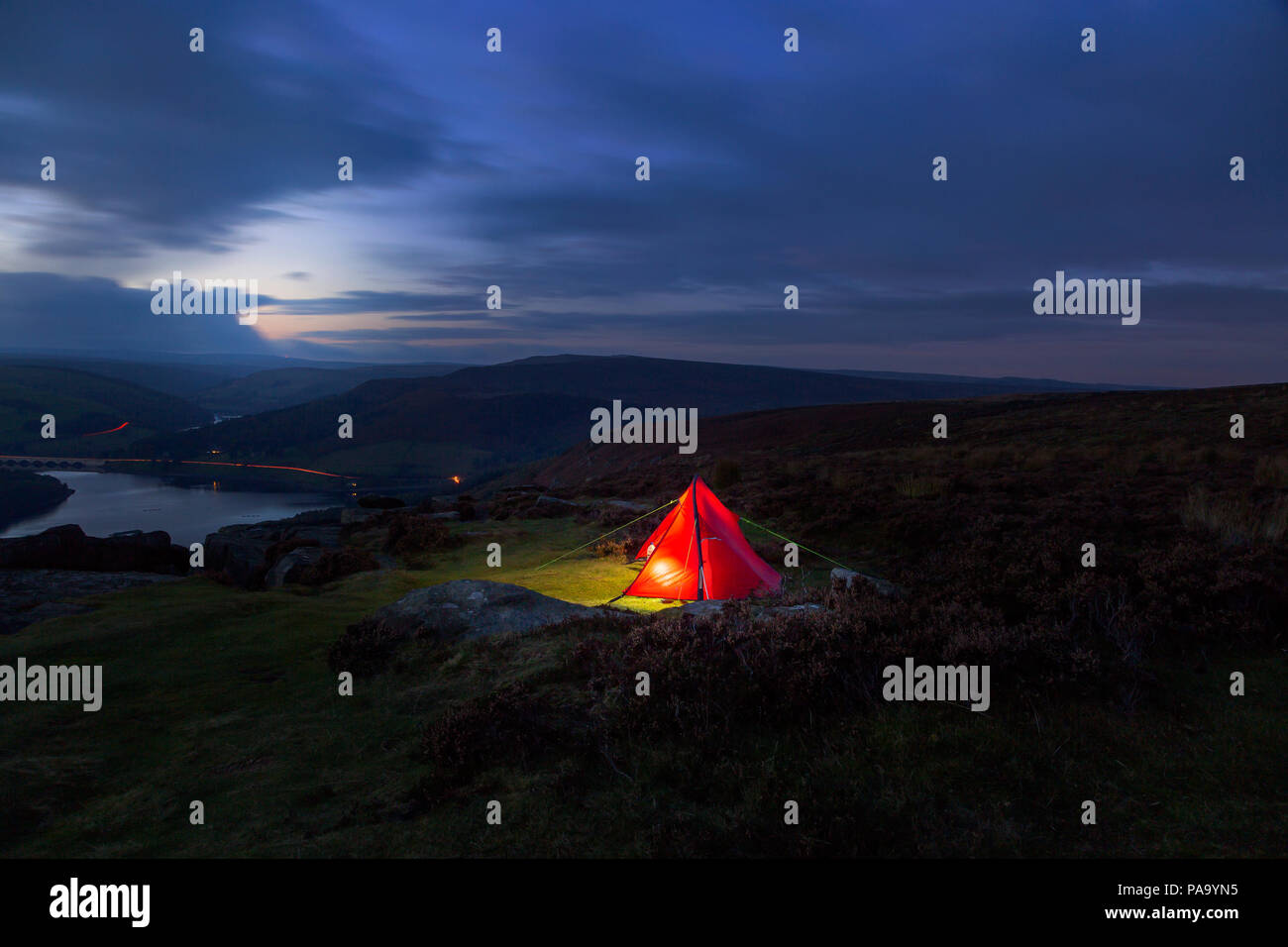 One Man Backpacker Tent Lit up, Camping on Bamford Edge in Peak District National Park, Derbyshire, England, UK Stock Photo