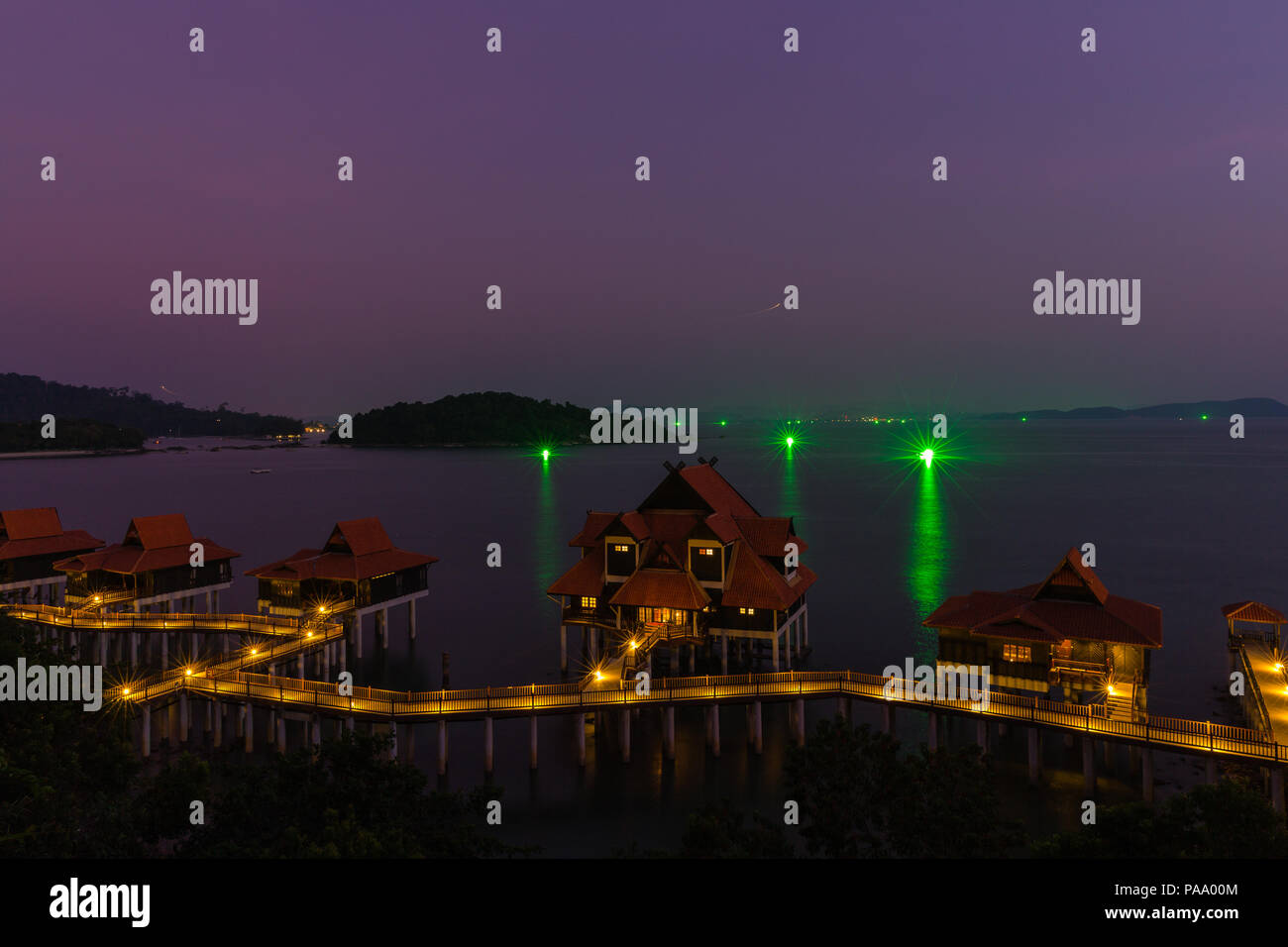 Fishing boats using green lights to attract fish work at night off
