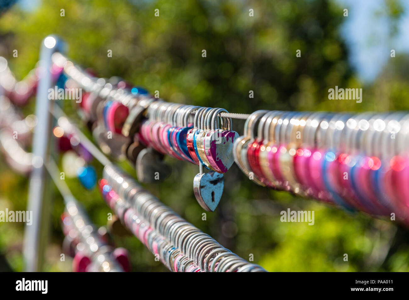 Padlocks hanging on wires, Langkawi, Malaysia Stock Photo