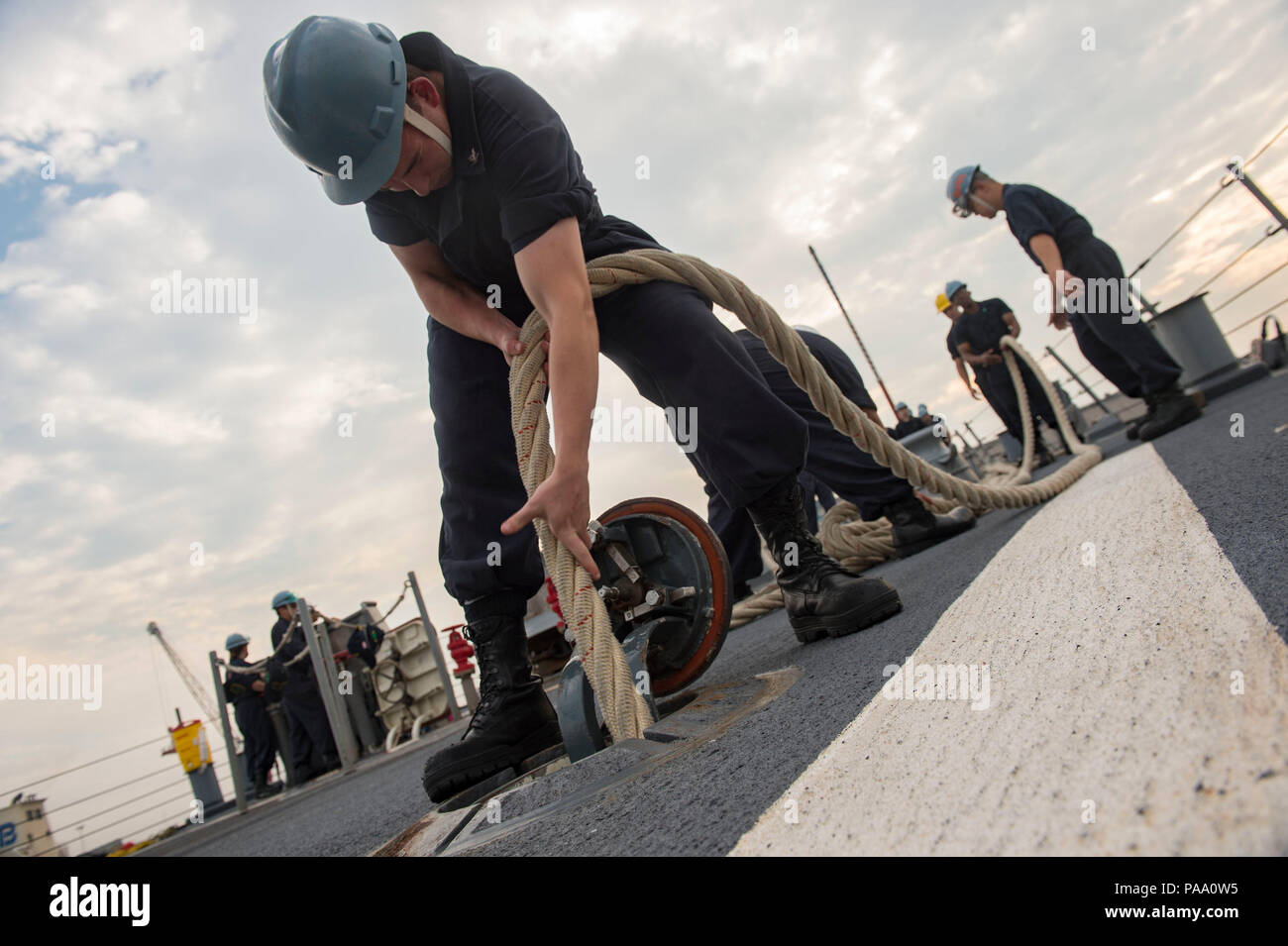 160304-N-MD297-012 PUERTO QUETZAL, Guatemala (March 4, 2016) - Information Systems Technician 3rd Class Justin Senechal, assigned to the Arleigh Burke-class guided-missile destroyer USS Lassen (DDG 82), prepares for sea and anchor detail as the ship pulls into Puerto Quetzal, Guatemala, for a brief stop for fuel (BSF). Lassen is deployed to the U.S. 4th Fleet area of responsibility supporting law enforcement operations as part of Operation Martillo. (U.S. Navy photo by Mass Communication Specialist 2nd Class Huey D. Younger Jr./Released) Stock Photo