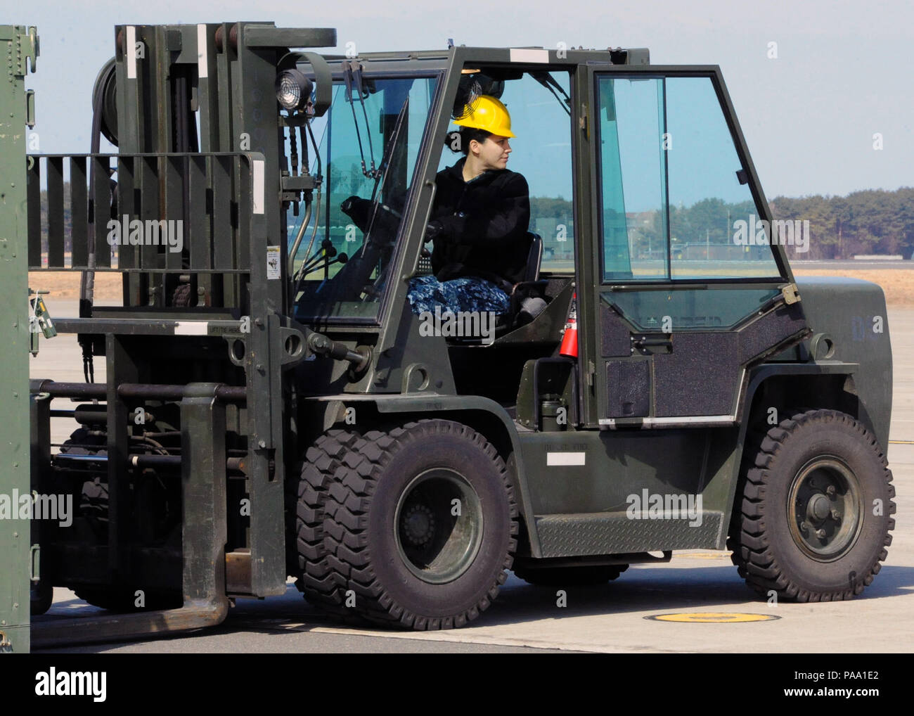 160316-N-EC644-012 MISAWA, Japan (March 16, 2015) Aviation Maintenance Administrationman 3rd Class Sheila Gomez, from Caguas, Puerto Rico, prepares to load equipment onto a C-130 cargo plane attached to U.S. Navy Fleet Logistics Support Squadron (VR) 64. (U.S. Navy Photo by Senior Chief Mass Communication Specialist Ryan Delcore/Released) Stock Photo