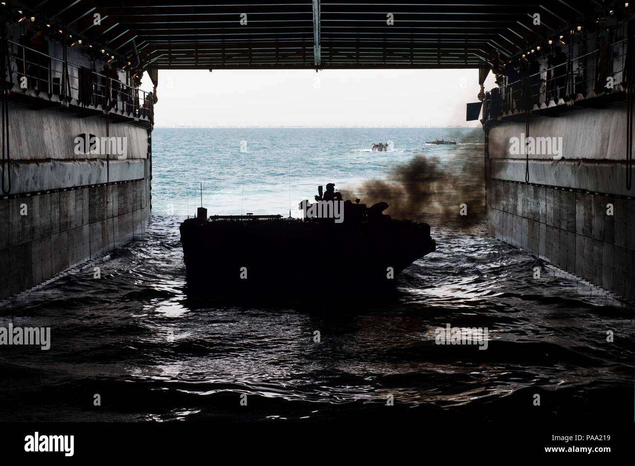 160308-N-JO245-044  ARABIAN GULF (March 8, 2016) An assault amphibious vehicle (AAV-7A1), embarked aboard the dock landing ship USS Oak Hill (LSD 51), manuevers in the ship’s well deck. The U.S. Navy, U.S. Marine Corps and Kuwait Armed Forces are conducting Amphibious Landing Exercise 2016 (PHIBLEX 16), a bilateral amphibious and ground exercise, to enhance operational readiness and improve interoperability between U.S. and regional partner forces. Oak Hill is part of the Kearsarge Amphibious Ready Group (ARG) and with the embarked 26th Marine Expeditionary Unit (MEU), is deployed in support o Stock Photo