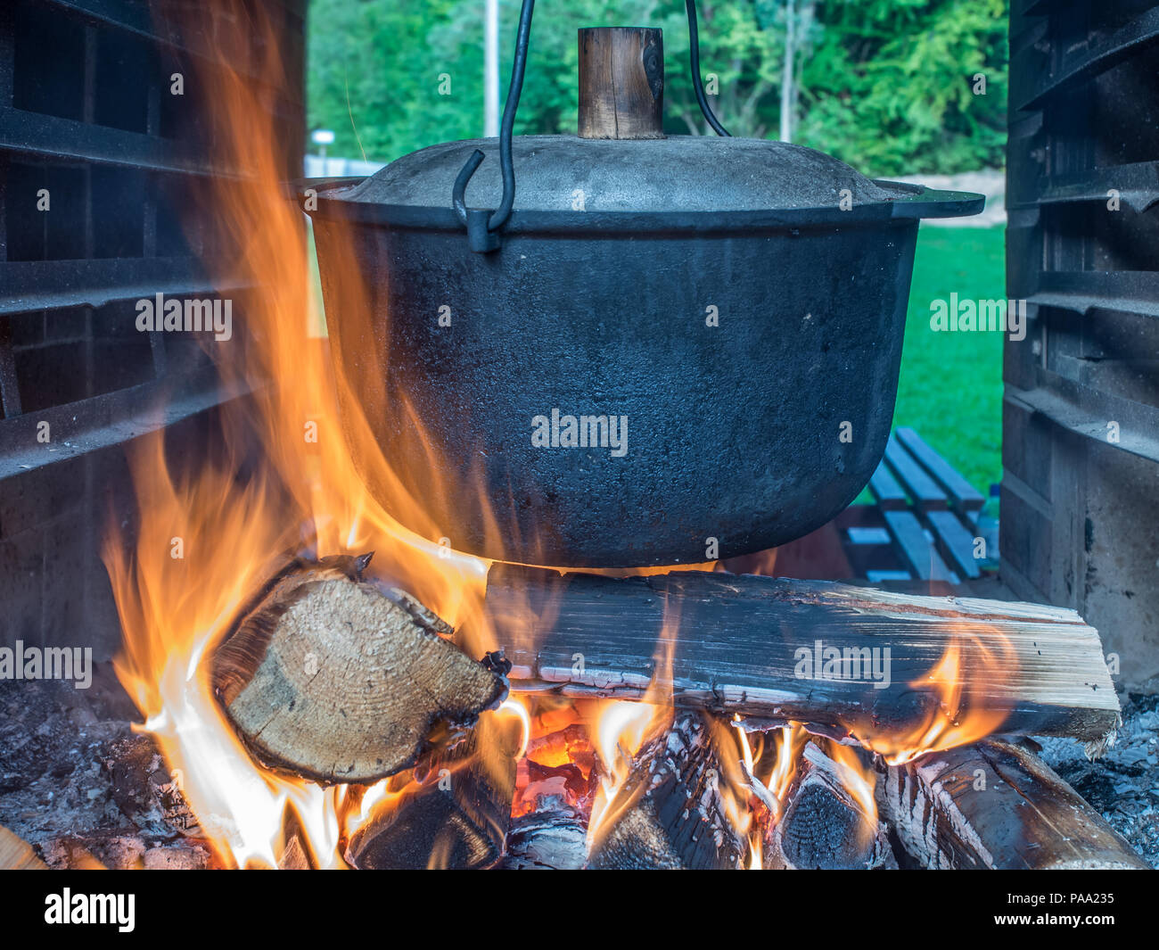 Cooking a meal on a campfire in metal vessels during a  canoeing excursion on the Wieprza river Stock Photo