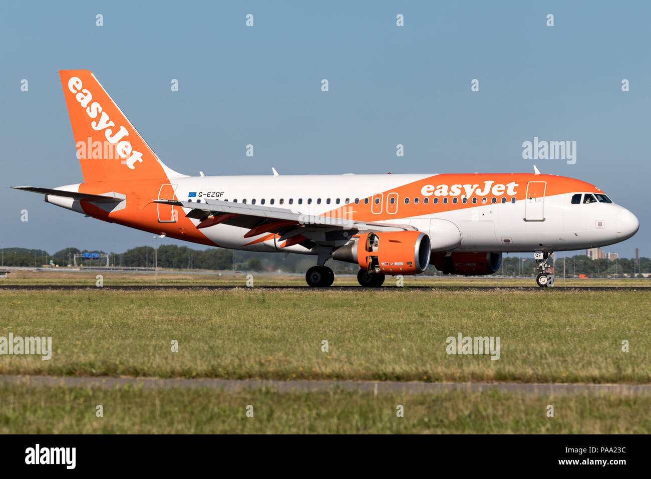British easyJet Airbus A319-100 with registration G-EZGF just landed on runway 18R (Polderbaan) of Amsterdam Airport Schiphol. Stock Photo