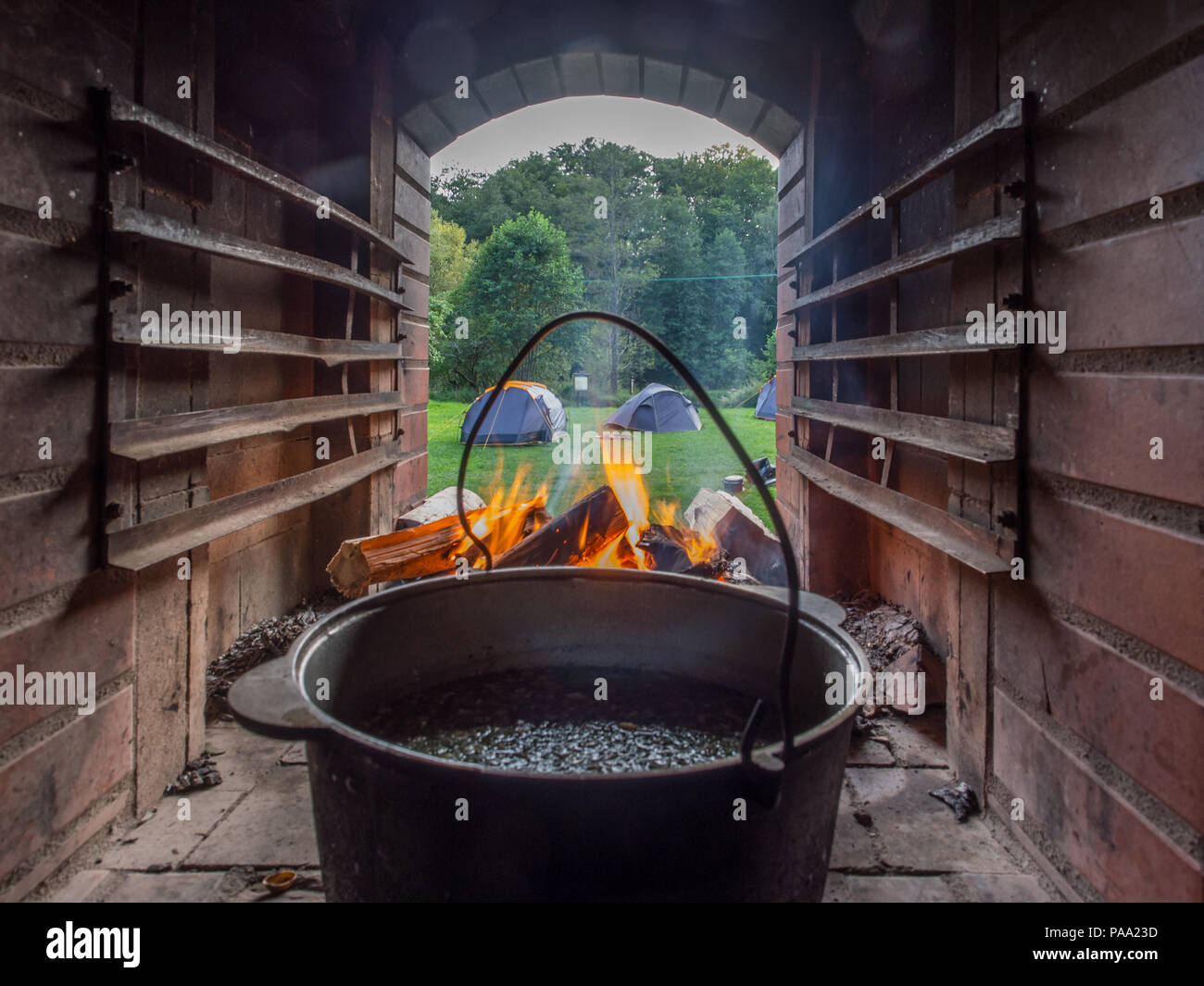 View of the camping at the Wieprza river through the fire place Stock Photo