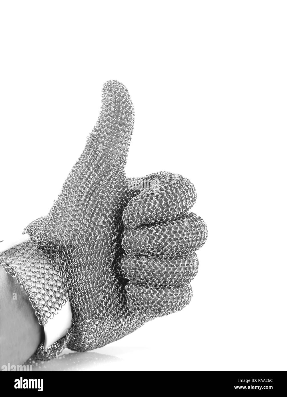 Hand with iron mesh glove on white background. Protection devices for industrial applications. Black and white tone. Stock Photo