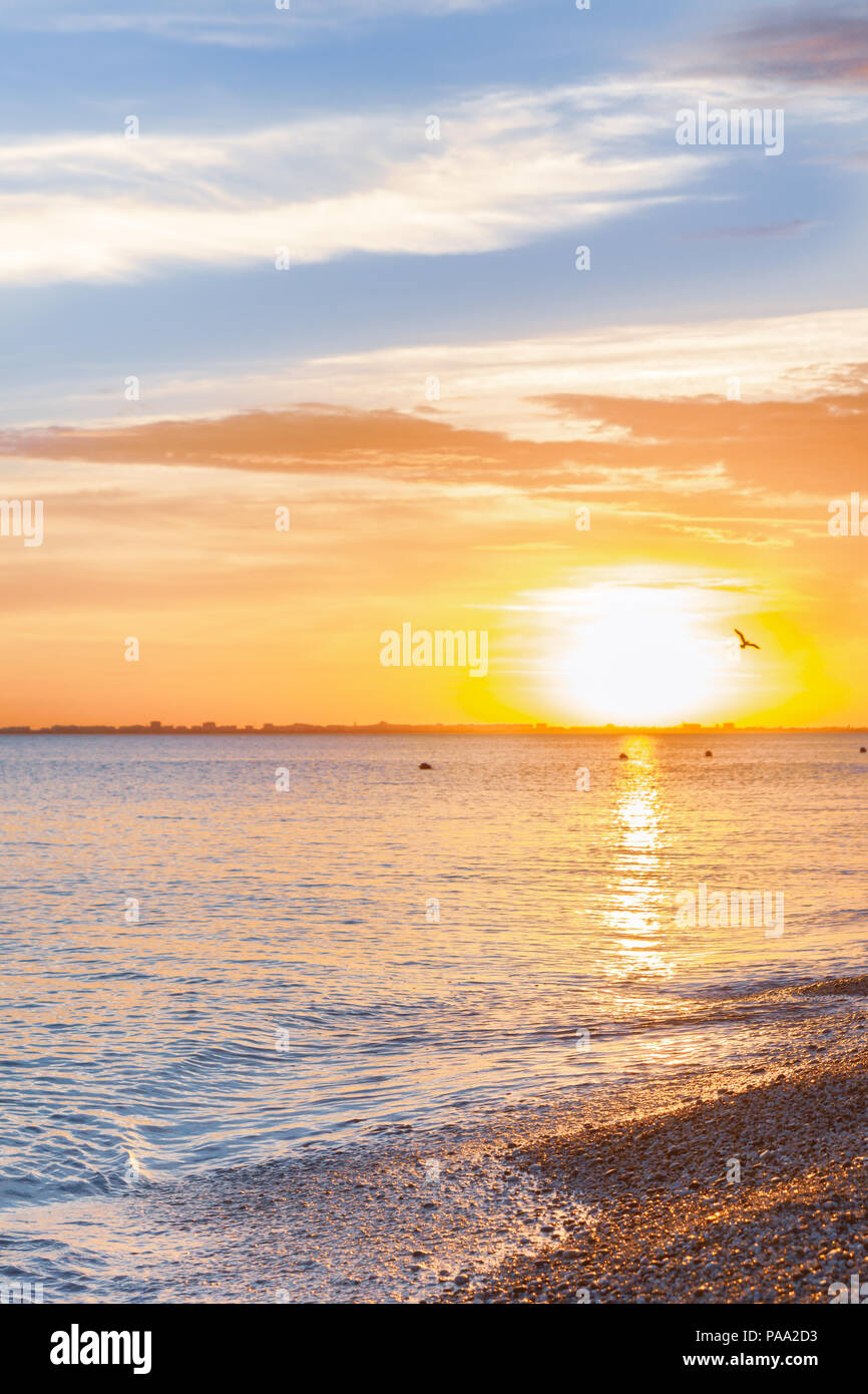 Beautiful summer sunset with clouds over the sea Stock Photo - Alamy