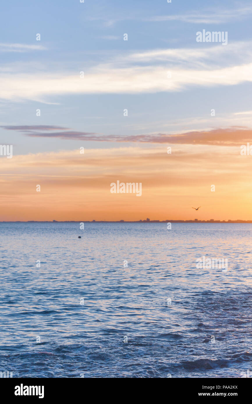 Beautiful summer sunset with clouds over the sea Stock Photo - Alamy
